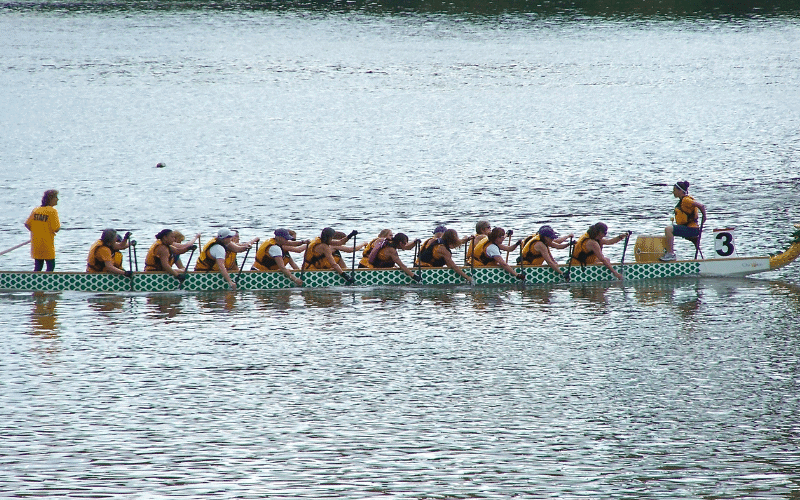 A rowing coach and young rowers utilize training resources for youth rowing